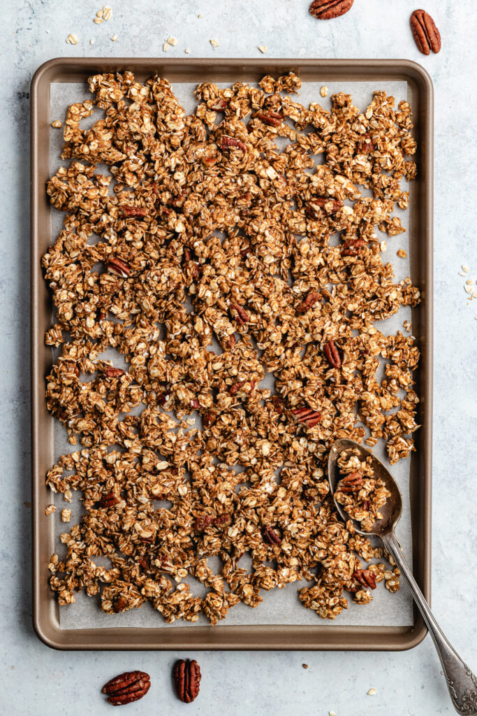 The granola on a baking sheet.