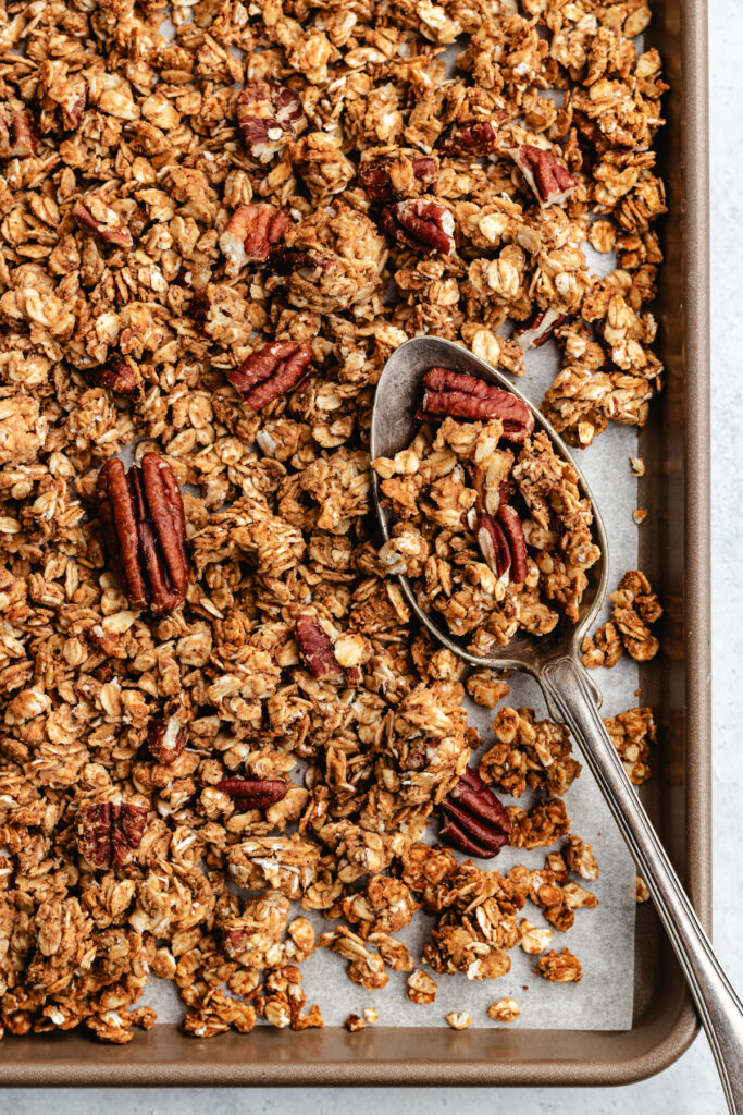 The granola on a baking sheet.