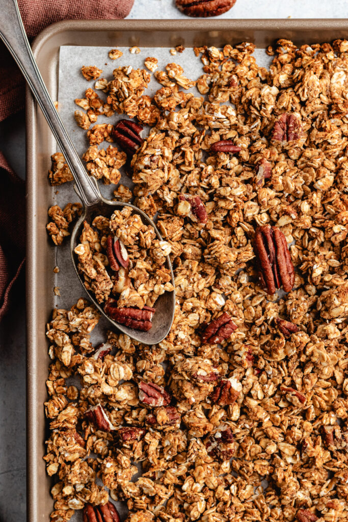 The granola on a baking sheet.