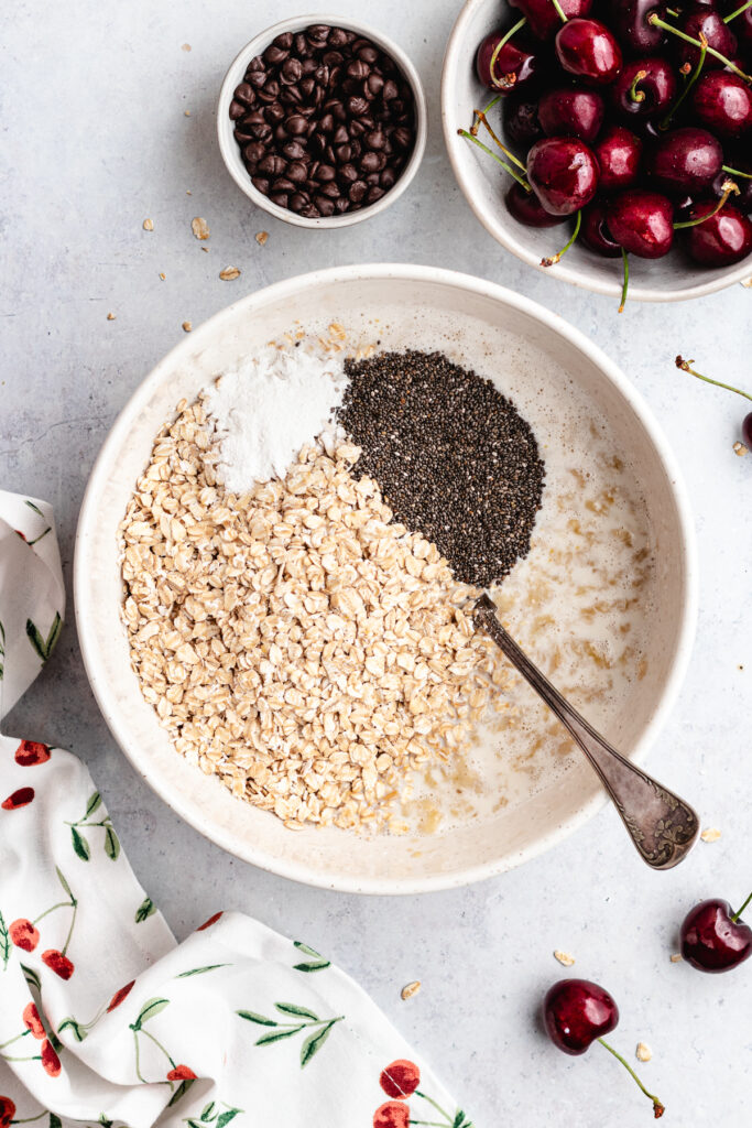 The oats, baking powder, chia seeds and salt to the bowl.