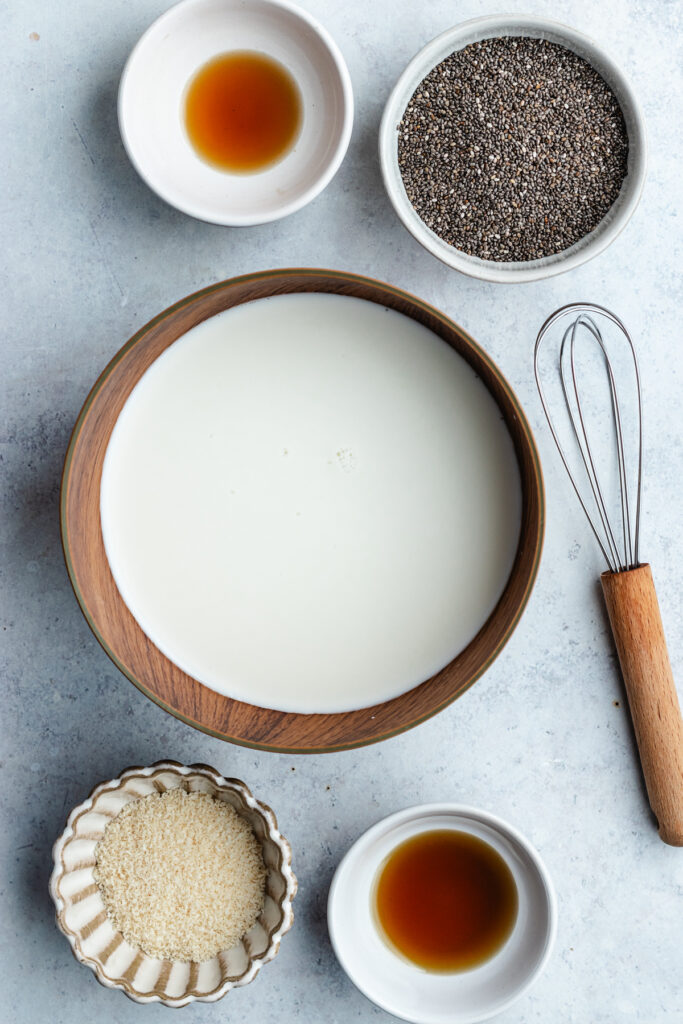 The ingredients in bowls with a whisk.