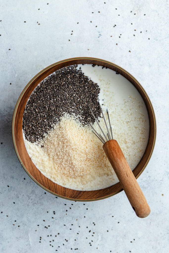 All the ingredients in a bowl with a whisk.