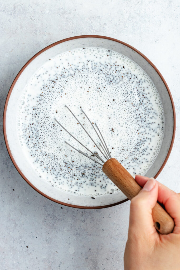 Stirring the ingredients whether with the whisk.