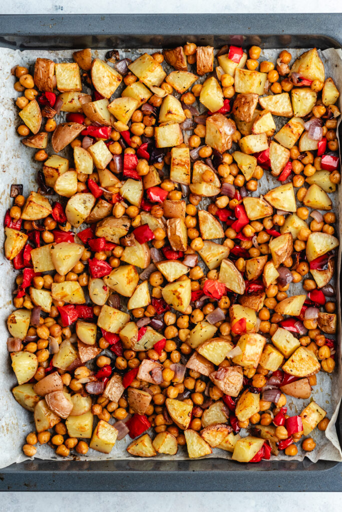 The roasted veggies on a baking sheet lined with parchment paper.