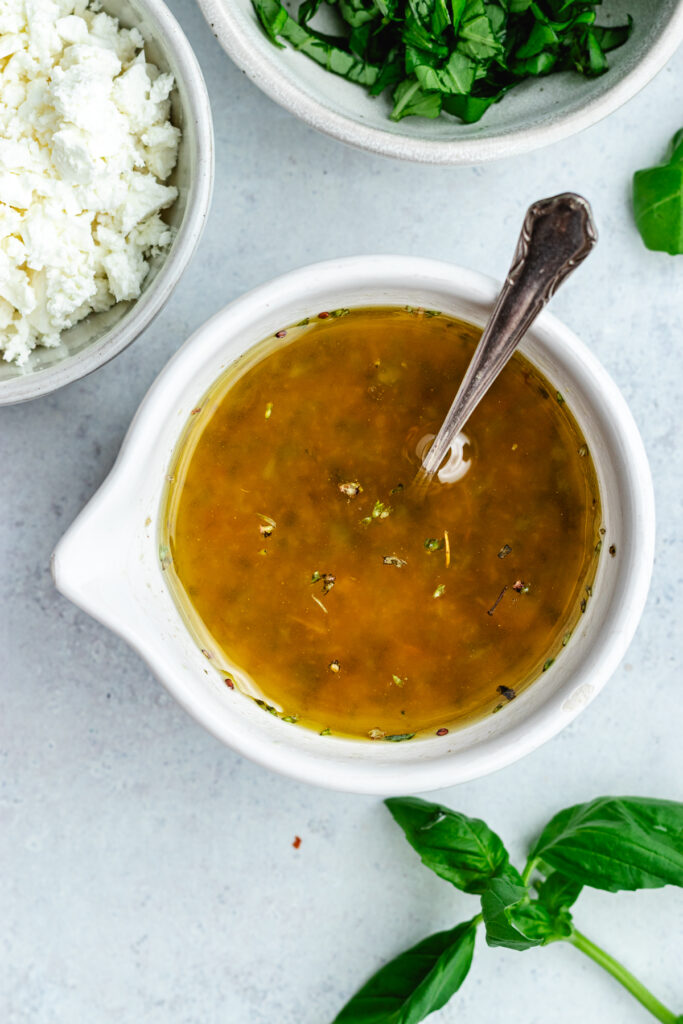 The dressing in a small bowl.