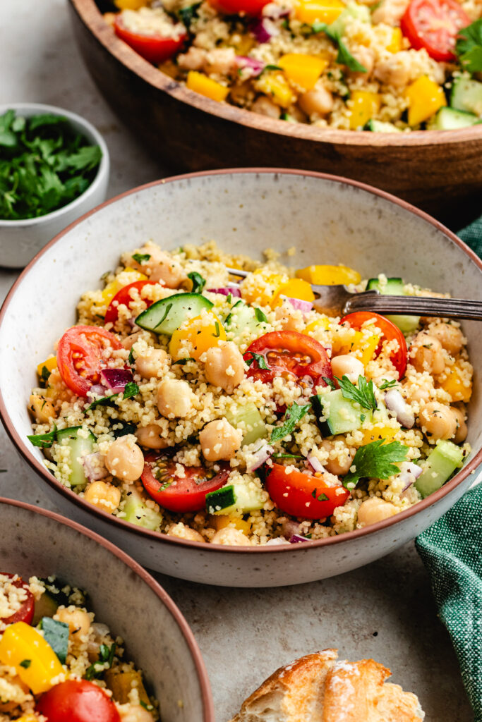 The salad in two bowls with a fork.