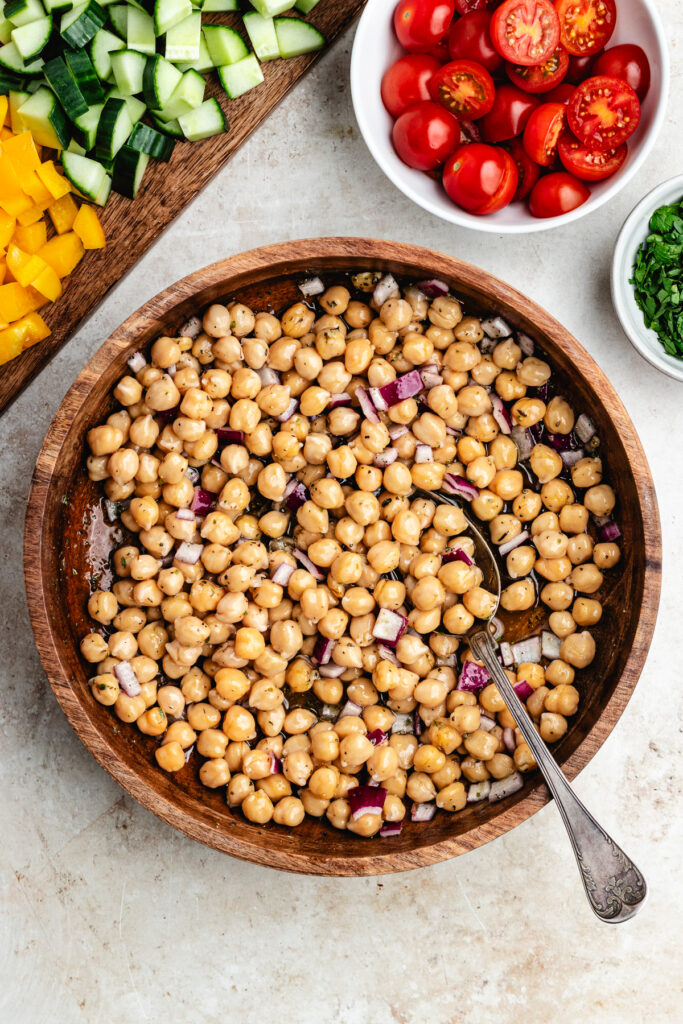 The chickpeas and chopped red onion marinating with the dressing.