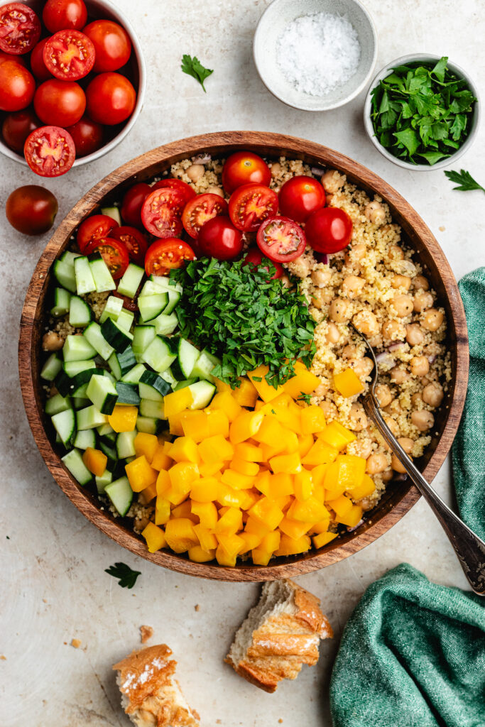 The chopped vegetables and herbs added to the salad bowl.