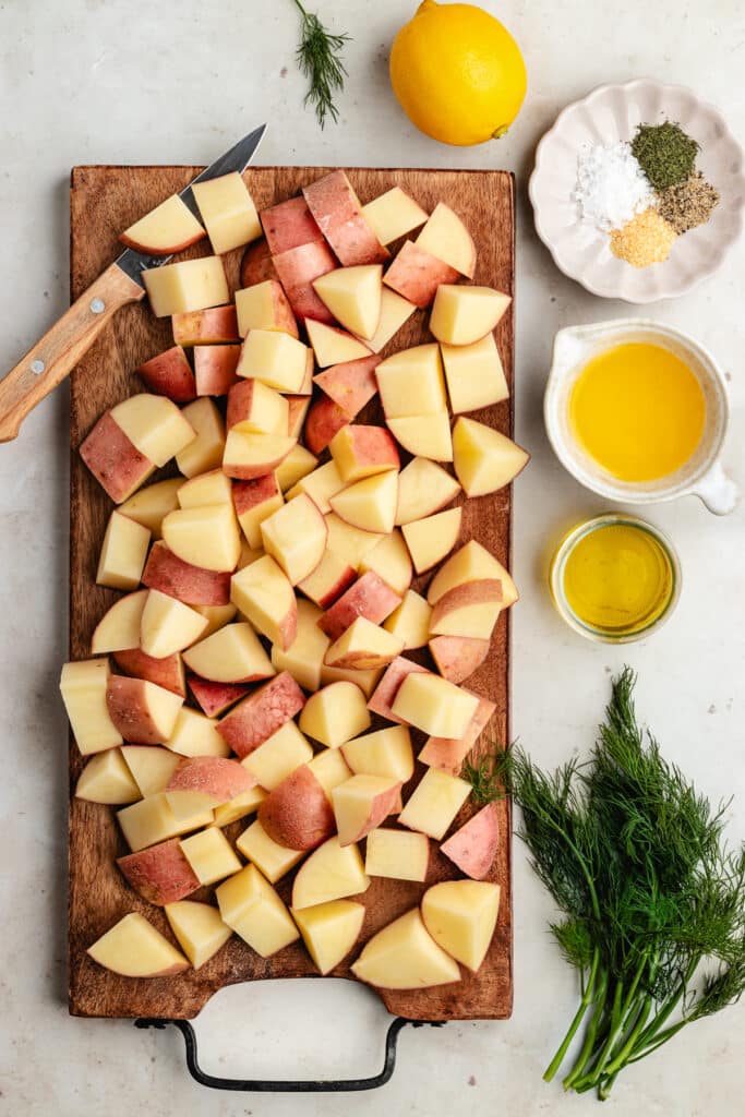 The chopped potatoes on a cutting board.