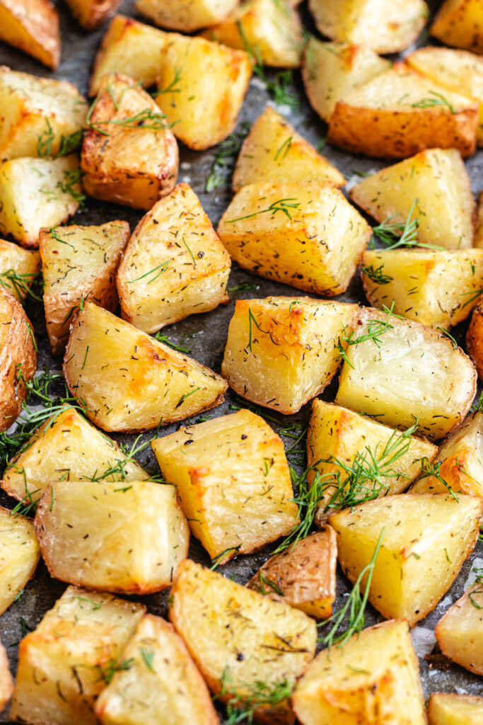 The roasted potatoes on the baking tray.