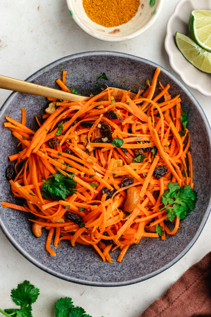 The salad in a small bowl with a fork.