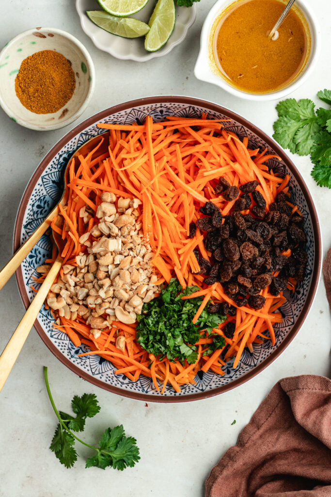 All the salad ingredients in the serving bowl.