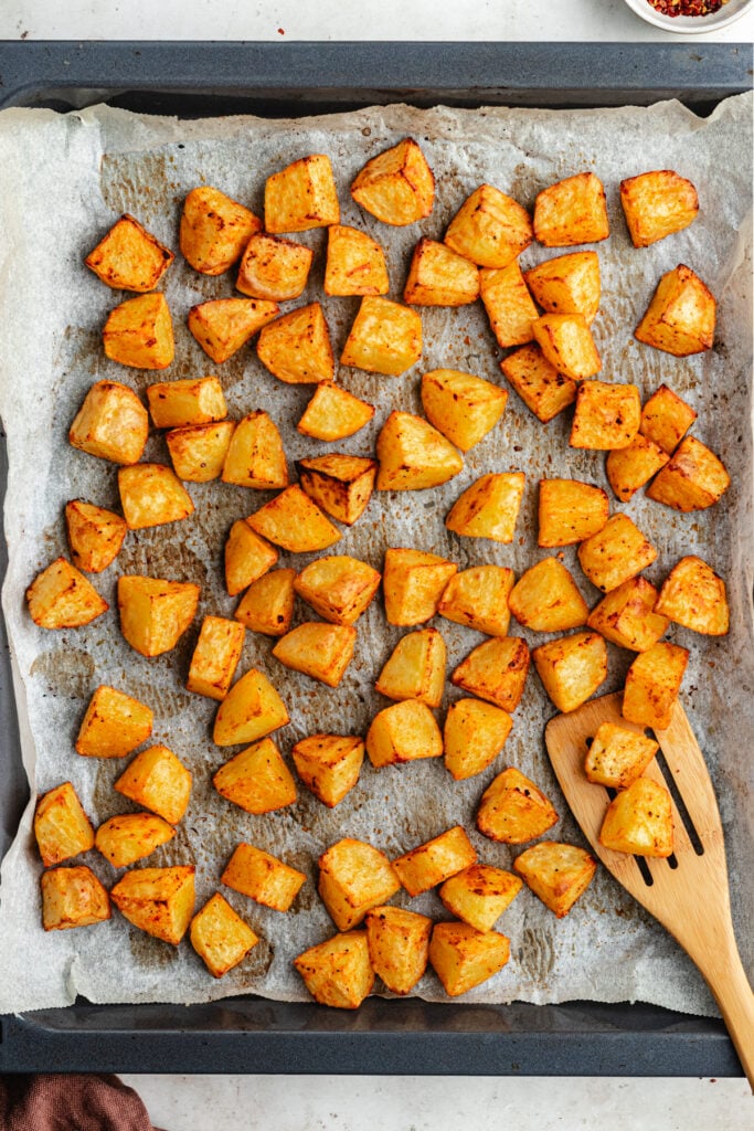 The roster potatoes on a sheet pan.