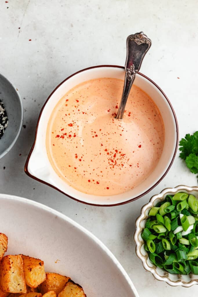 The dressing in a small bowl.