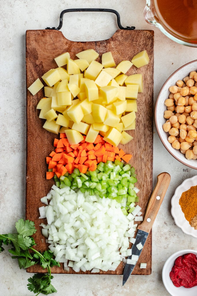 The chopped vegetables on a cutting board.