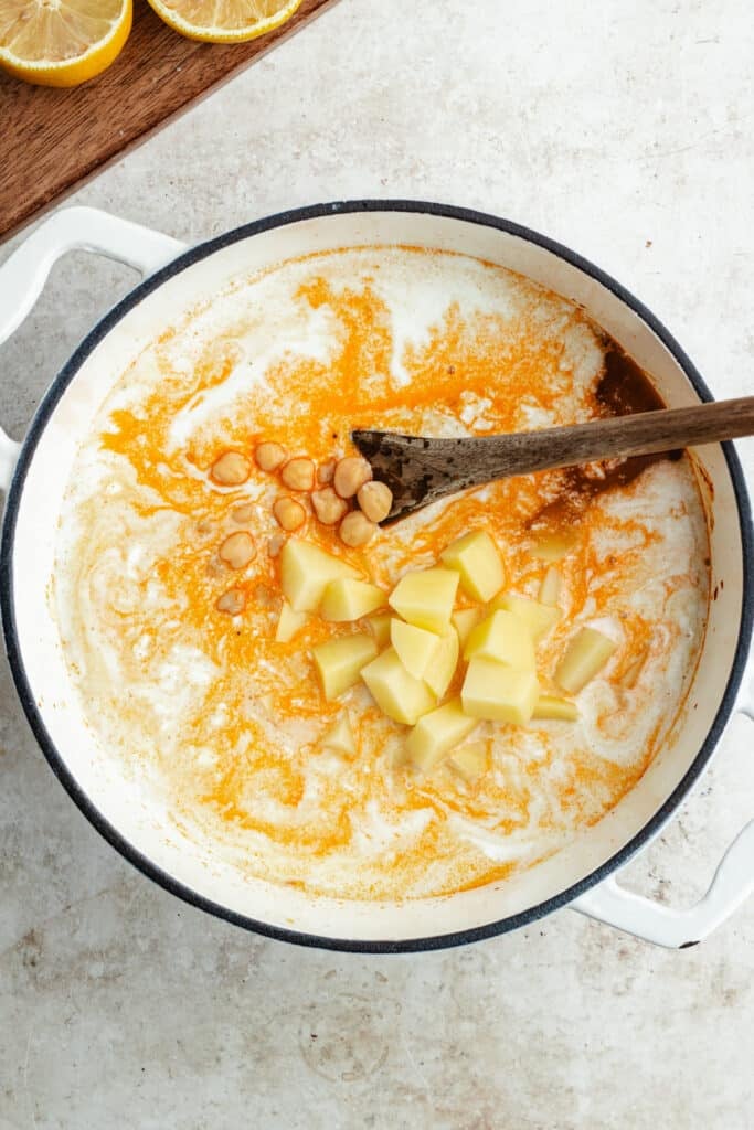 The soup before cooking in a Dutch oven pot.