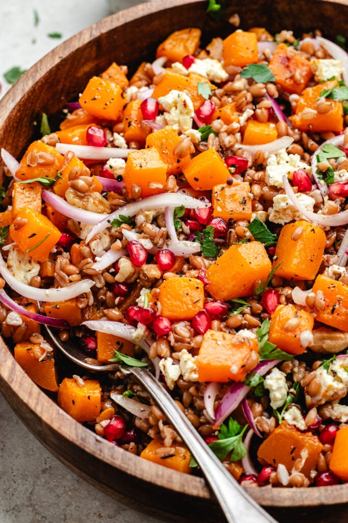 The salad in a wooden salad bowl.