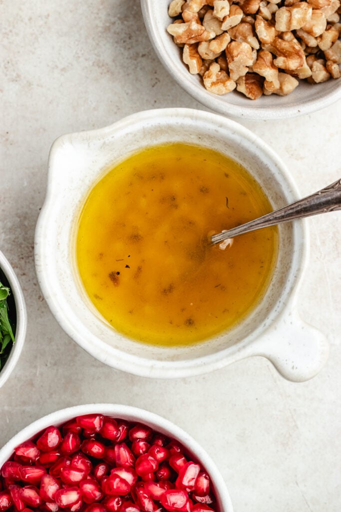 The dressing in a small bowl.